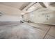 Spacious garage featuring epoxy flooring, ample storage, and room for multiple vehicles at 26004 E Elmhurst Pl, Aurora, CO 80016
