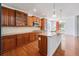 A spacious kitchen with ample counter space, wood cabinets, modern appliances, and an island perfect for cooking and entertaining at 26004 E Elmhurst Pl, Aurora, CO 80016