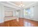 Bright room with elegant trim, natural light, and carpet flooring at 26004 E Elmhurst Pl, Aurora, CO 80016