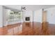 Spacious living room with fireplace, large windows, and hardwood flooring at 26004 E Elmhurst Pl, Aurora, CO 80016