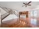 Open-concept living space featuring stairs to second floor and kitchen views at 26004 E Elmhurst Pl, Aurora, CO 80016