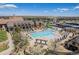 An aerial view featuring a large swimming pool and lounge area within a community clubhouse at 26004 E Elmhurst Pl, Aurora, CO 80016