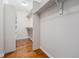 Spacious walk-in closet featuring wooden floors, shelving and ample room for organization and storage at 26004 E Elmhurst Pl, Aurora, CO 80016