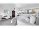 Serene bedroom with ample natural light, city views, and stylish decor at 100 Park W Ave # 1606, Denver, CO 80205