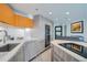 Modern kitchen featuring sleek countertops, stainless steel appliances, and ample cabinet space at 100 Park W Ave # 1606, Denver, CO 80205