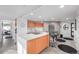 Bright open-concept kitchen with modern appliances and colorful cabinetry at 100 Park W Ave # 1606, Denver, CO 80205