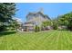 Expansive backyard featuring lush lawn and mature trees, ideal for recreation and entertaining at 5272 W Capri Pl, Littleton, CO 80123