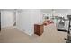 Spacious finished basement with neutral carpet, fitness area, and adjacent living area; perfect for flexible living at 5272 W Capri Pl, Littleton, CO 80123