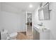 Modern basement bathroom features a sleek vanity and tiled floor, adding convenience and style at 5272 W Capri Pl, Littleton, CO 80123