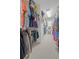 Walk-in closet with ample hanging space, shelving, and organized storage for clothing and accessories at 5272 W Capri Pl, Littleton, CO 80123