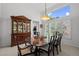 Formal dining room with elegant wood table, chairs, and china cabinet at 5272 W Capri Pl, Littleton, CO 80123