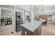 Spacious kitchen with large island, stainless steel appliances and breakfast nook at 5272 W Capri Pl, Littleton, CO 80123