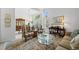 Bright living room with classic furnishings, large windows, and an open layout, ideal for entertaining at 5272 W Capri Pl, Littleton, CO 80123