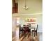 Bright dining room with rustic wooden table and chairs with a view to the living room at 9686 W 106Th Ave, Broomfield, CO 80021