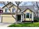 Charming two-story home with a well-maintained lawn and attached two-car garage at 9686 W 106Th Ave, Broomfield, CO 80021