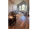 Open-concept living area with ample seating, natural light, and hardwood floors throughout at 9686 W 106Th Ave, Broomfield, CO 80021