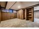 Finished basement features built-in shelving and closet at 5420 Manitou Rd, Littleton, CO 80123