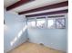 Light blue bedroom with multiple windows and carpet at 5420 Manitou Rd, Littleton, CO 80123