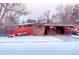 Brick ranch home with carport, snow covered yard at 5420 Manitou Rd, Littleton, CO 80123