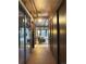 Long hallway with tiled floor, leading to living room at 5420 Manitou Rd, Littleton, CO 80123