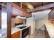 Mid-century kitchen with wood cabinets and stove top at 5420 Manitou Rd, Littleton, CO 80123