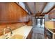 View of kitchen with wood cabinets and access to backyard at 5420 Manitou Rd, Littleton, CO 80123