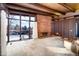 Living room with brick fireplace and large windows at 5420 Manitou Rd, Littleton, CO 80123