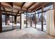 Living room with wall of windows and patio access at 5420 Manitou Rd, Littleton, CO 80123