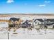 Wide shot of homes on a snow covered street at 3361 N Buchanan Way, Aurora, CO 80019