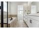 Modern bathroom with soaking tub and double vanity at 3361 N Buchanan Way, Aurora, CO 80019