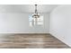 Bright dining room with hardwood floors and a chandelier at 3361 N Buchanan Way, Aurora, CO 80019