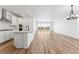 Spacious living room with hardwood floors and sliding glass doors leading to a patio at 3361 N Buchanan Way, Aurora, CO 80019