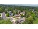 Scenic aerial view of a residential area with mature trees, and well-maintained landscaping at 6223 W Flora Pl, Denver, CO 80227
