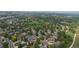 Expansive aerial view showcasing a neighborhood with lush greenery and well-maintained streets at 6223 W Flora Pl, Denver, CO 80227