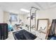 Finished basement set up as a home gym with a weight rack and various equipment at 6223 W Flora Pl, Denver, CO 80227