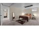 Basement bedroom with neutral walls, carpeted floor, and minimal furnishings at 6223 W Flora Pl, Denver, CO 80227