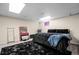 Cozy basement bedroom with dark furnishings and a small vanity area at 6223 W Flora Pl, Denver, CO 80227