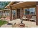 Cozy front porch with comfortable seating, tasteful decor, and a welcoming entrance at 6223 W Flora Pl, Denver, CO 80227