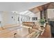 Bright and airy living room with skylights, wood-beam ceilings, and comfortable seating at 6223 W Flora Pl, Denver, CO 80227