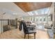 Stylish living area featuring skylights, hardwood floors, and an open floor plan at 6223 W Flora Pl, Denver, CO 80227
