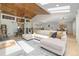 Spacious living room with wood accents, comfortable seating, and abundant natural light at 6223 W Flora Pl, Denver, CO 80227