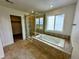 Bathroom featuring a tiled shower and tub at 13358 Blue Amber Ct, Parker, CO 80134