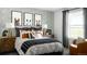 Comfortable bedroom with stylish decor, a cozy bed, and natural light from the window at 13358 Blue Amber Ct, Parker, CO 80134