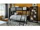 Bedroom with a bunk bed, stylish rug, and unique decor creating a fun and inviting space at 13358 Blue Amber Ct, Parker, CO 80134