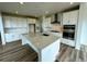 Open kitchen features a large island, stainless steel appliances, and plenty of counter space at 13358 Blue Amber Ct, Parker, CO 80134