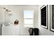 Bright laundry room with modern appliances, ample storage, and natural light at 13358 Blue Amber Ct, Parker, CO 80134