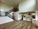 Open-concept living room showcasing a staircase and kitchen island at 13358 Blue Amber Ct, Parker, CO 80134