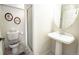 Cozy bathroom with pedestal sink and shower featuring neutral tones, perfect for relaxation at 1427 Deerwood Dr, Longmont, CO 80504