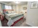 Bedroom with neutral walls, plush carpeting, natural light and a decorative dresser at 1427 Deerwood Dr, Longmont, CO 80504