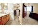 Bathroom next to bedroom, featuring closet and vanity at 1427 Deerwood Dr, Longmont, CO 80504